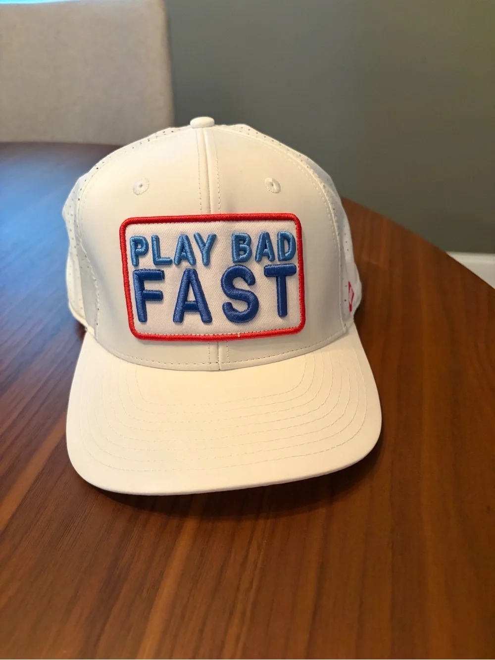 PLAY BAD FAST SNAPBACK HAT